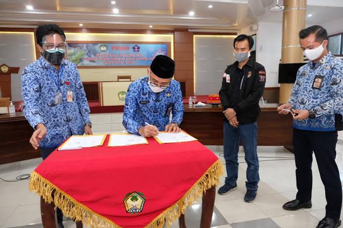 KPU, Gugus tugas penanganan covid dan Dinkes Gowa teken kerjasama. (Foto: Berita.news/Putri)