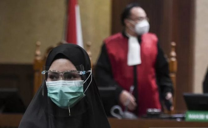 					Dokumentasi - Terdakwa kasus penerimaan suap dari Djoko Tjandra terkait pengurusan fatwa Mahkamah Agung (MA) Pinangki Sirna Malasari menjalani sidang pembacaan tuntutan di Pengadilan Tipikor, Jakarta, Senin (11/1/2021). ANTARA FOTO/Hafidz Mubarak A/wsj.