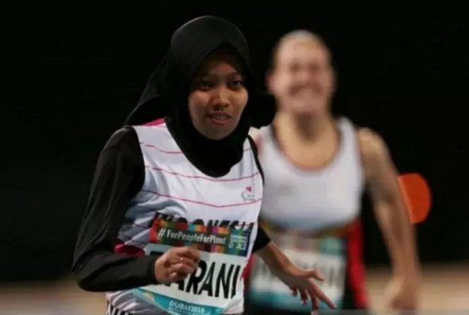 					Arsip foto - Atlet para atletik Indonesia Karisma Evi Tiarani usai memecahkan rekor dunia di nomor 100m putri kelas T63 dalam kejuaraan World Para Athletics Championships 2019 yang digelar di Dubai, Uni Emirat Arab, Kamis (14/11/2019). ANTARA/REUTERS/Christopher Pike/aa.