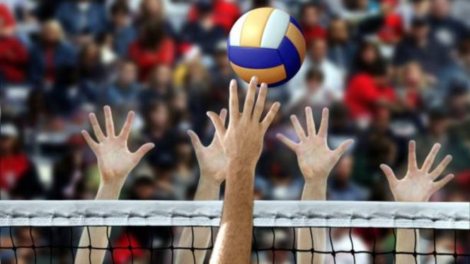 					Lonjakan Pemain Voli dengan Tangan Menghalangi di Atas Jaring. (Foto: istockphoto)